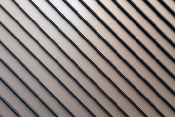 Obraz premium Wall panel with diagonal aluminum slats and elegant texture. Industrial material.