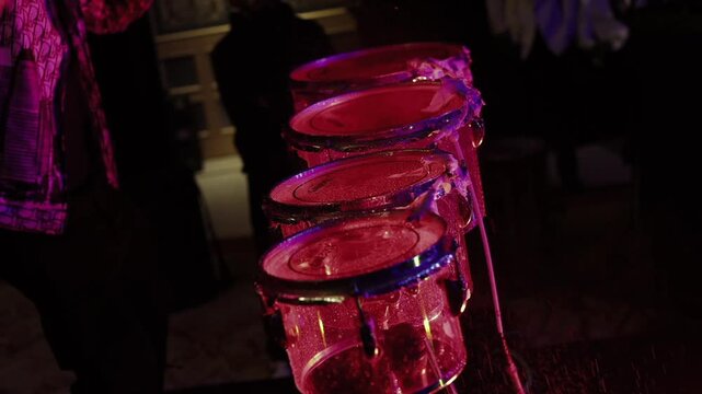 A slow motion shot of drummer performing at an Indian wedding celebration