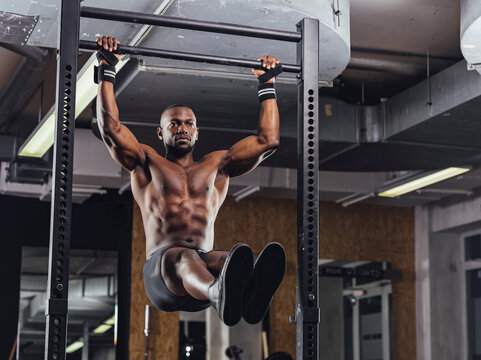Athlete doing push ups in gym