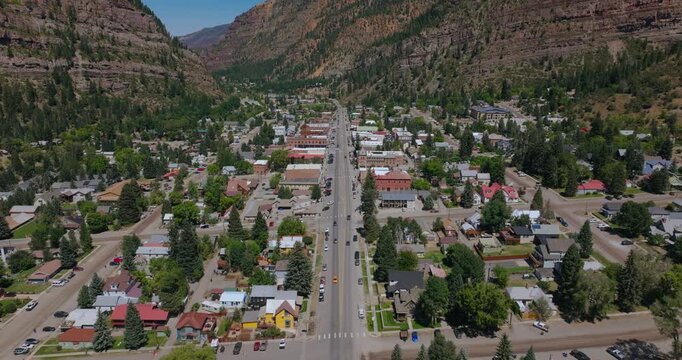 Aerial of Ouray Colorado town layout surrounded by dramatic San Juan Mountains