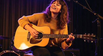 Obraz premium A woman playing an acoustic guitar on stage with a microphone