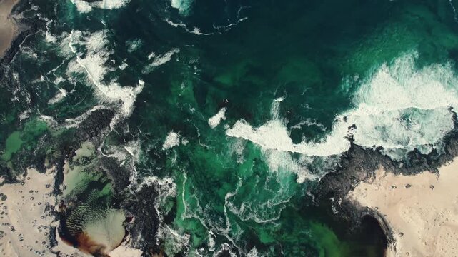 Drone shot of natural textures shaped by tide in tidal pools