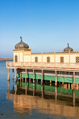 Fototapeta premium Wooden building on a pier a sunny summer day
