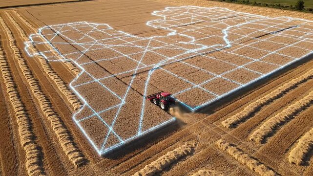 Aerial view of a tractor creating a crop circle pattern in a harvested wheat field.