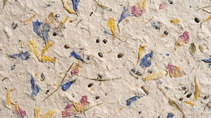 Fototapeta premium Close-up macro view of textured off-white surface covered with colorful fragments, highlighting texture, color and fragment details