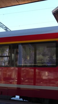 Klosters, Switzerland 15 February 2026,Rhaetian railway red train departing from station in switzerland