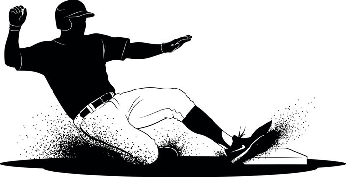 Baseball player sliding into base in silhouette