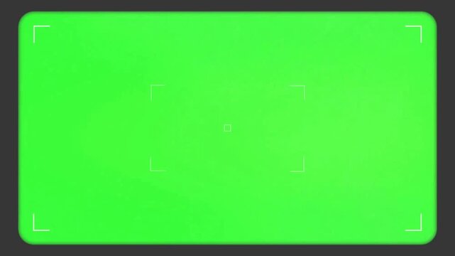Professional camera viewfinder overlay with white corner marks appearing and fading on a bright green screen background for cinematography and filming