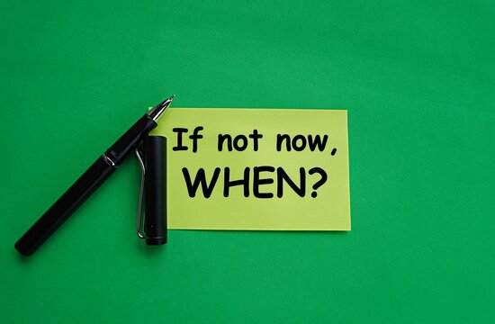 Pen and yellow note written if not now, when? Self-development concept, avoid procrastination and do important things immediately