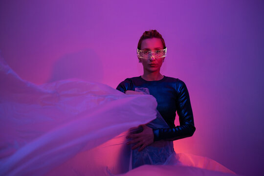 Futuristic neon portrait with glowing glasses and cyberpunk art style