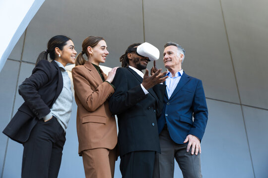 Business professionals in Barcelona experiencing virtual reality outdoors