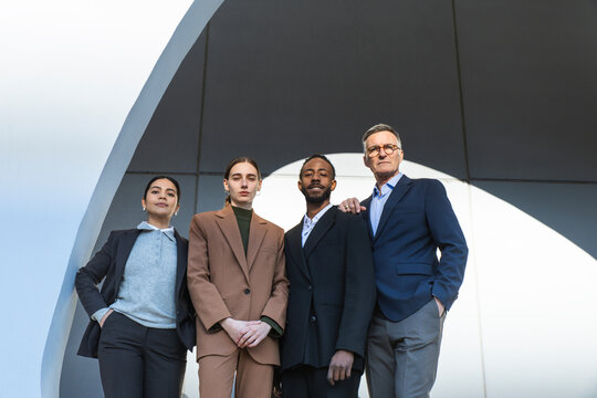 Confident business professionals in formal wear standing in Barcelona