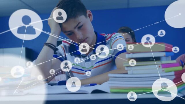 Male student studying in classroom, icons rising from textbooks, connecting and overlaying scene