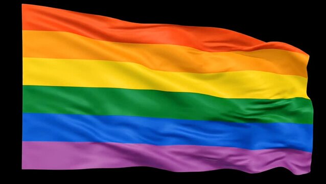 A vibrant rainbow pride flag, symbolizing LGBTQ+ rights and diversity, waves gracefully against a dark background, showcasing its six distinct colors.