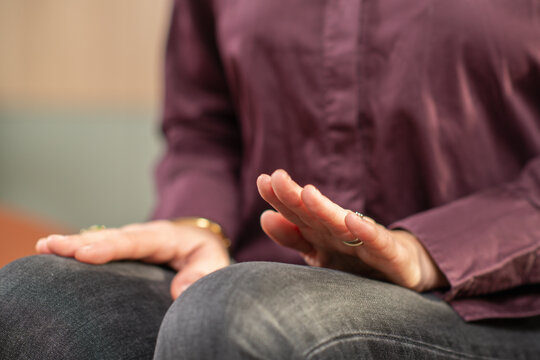 Woman performing self-guided EMDR tapping using legs to calm the nervous system. Highlights controlled movement and focused awareness.