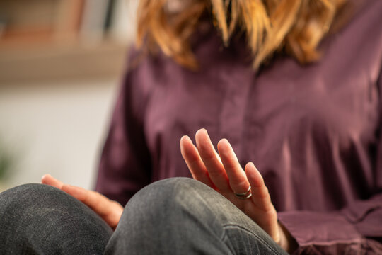 Woman practicing alternating leg tapping as part of EMDR self-regulation. Emphasizes bilateral rhythm, posture stability, and therapeutic focus.