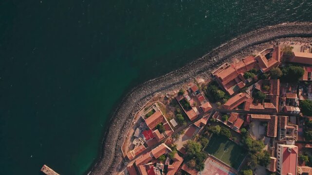 Aerial view of Gor&eacute;e Island, a UNESCO World Heritage site, is magical during the day with a magical sunset