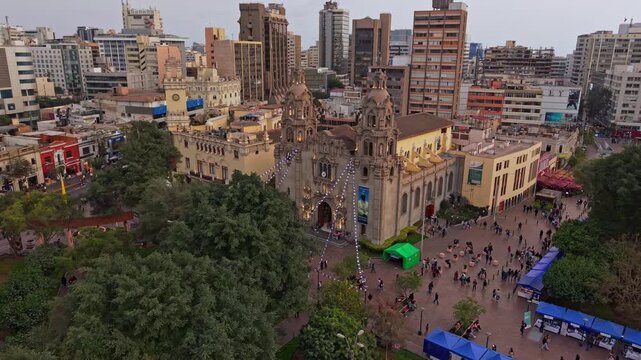 Aerial view of Virgen Milagrosa Church in lively Miraflores, Lima