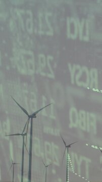 Vertical video: arrow starting offscreen, rising diagonally over rotating turbines, showing growth