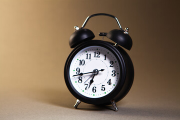 Naklejka premium alarm clock on a black background
