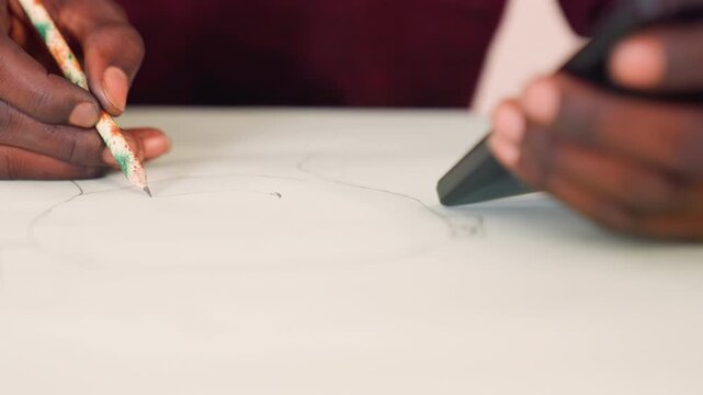 Artist carefully refining pencil drawing details. Creating precise and subtle shading in creative environment. Artist meticulously shaping and refining outline with eraser in calm studio setting