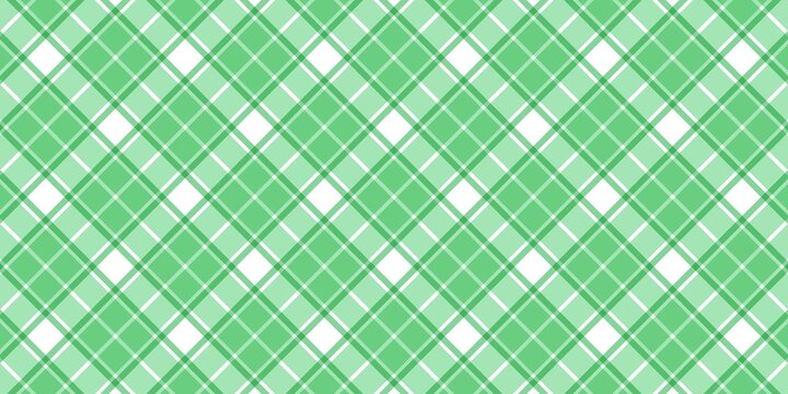 Green and white diagonal plaid pattern background. Seamless checkered tartan texture for St. Patrick's Day, spring fashion, wrapping paper, and textile design. Classic preppy geometric fabric style.