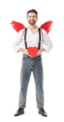 Naklejka premium Man dressed as Cupid with heart on white background. Valentine's Day celebration