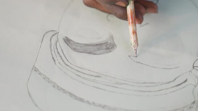 Closeup black hands sketching portrait paper, portrait artist shading eye and brow with graphite pencil, delicate linework on textured sheet, focused studio mood, thoughtful expression emerging