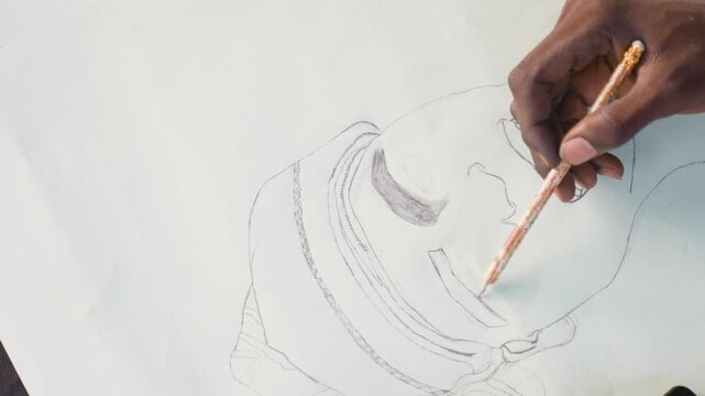 Black portraitist adding tonal lines on paper, closeup view of black hands guiding brush through delicate washes, calm ambient light, introspective pace and refined draftsmanship