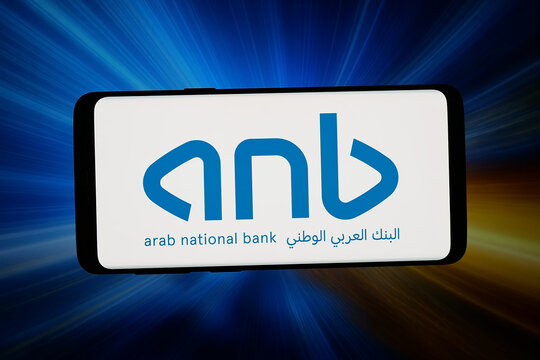 Stuttgart, Germany - 02-25-2026: In this photo illustration, the logo of financial company Arab National Bank (ANB) is displayed on a smartphone in front of abstract background on computer screen.
