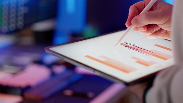 Tablet stylus orange bar chart upward arrow growth. Digital financial interface rising columns positive trend revenue increase performance improvement analytics evaluation corporate strategy