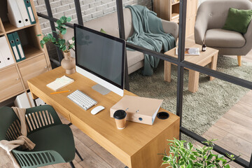 Fototapeta premium Interior of comfortable modern office with folding screen and workplace