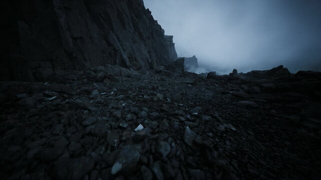 Rugged pebble slope at dusk, dramatic coastal terrain perfect for storm chase or geological survey setting, textured stones and steep ridge, lowlight blues