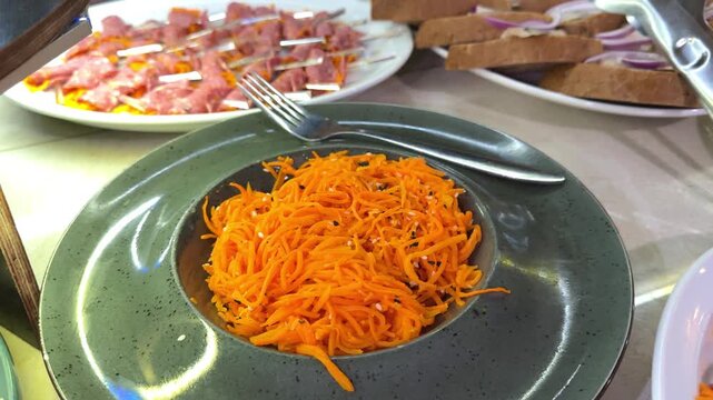 Strips of carrots marinate in a mixture of vinegar, garlic, and cayenne, which adds tang and just a small kick of spice.