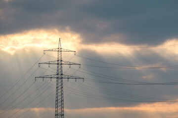 Electricity Pylon and Power Lines Under Dramatic Sky