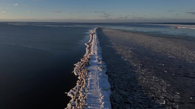 Drone View of Winter Road Leading to Lighthouse 
