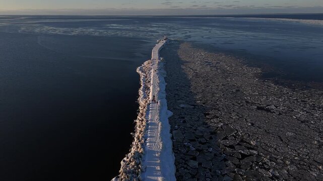 Drone View of Winter Road Leading to Lighthouse