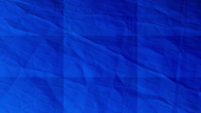 Deep royal blue abstract textured background soft crumpled paper waves overlaid with a subtle grid pattern animation its a animated motion background