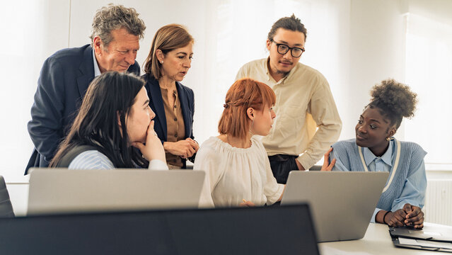Diverse Leadership Team Making Strategic Decisions, Taking Responsibility in Modern Office Meeting