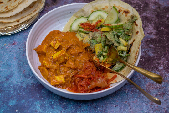 Pland based thai red curry bowl and rice. Tofu and flavorful vegetables.