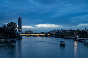 Obraz premium Scenic view of the Guadalquivir River in Seville, Spain