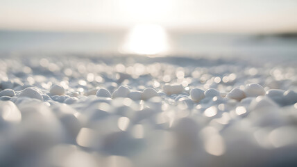 Obraz premium Extreme close-up of smooth, white, pebble-like textures with soft, glowing bokeh highlights under bright sunlight.