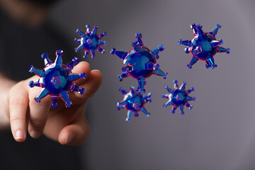 3D render of virus particles near hand, representing disease, pandemic, and health concepts....