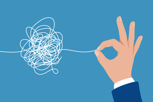 Hand holding thread unknotting tangled mess