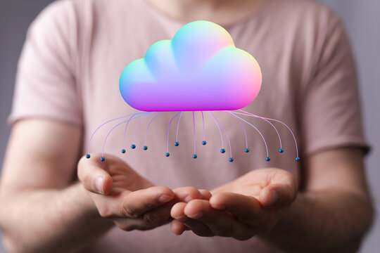 Person holding a 3D cloud icon representing cloud computing, data, and technology in their hands.  Concept of data stora