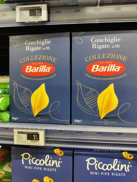 Saujon, France - January 24, 2026: Intermarche. Barilla Conchiglie Rigate pasta boxes displayed on a supermarket shelf, featuring blue packaging and visible price tags