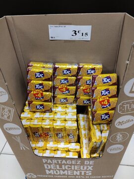 Saujon, France - January 24, 2026: Intermarche. Display of Tuc Original crackers in a cardboard box with multiple packs visible, pricing label attached on top in a retail setting