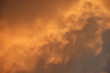 Fototapeta premium white and orange cloud spreading on twilight sunset blue sky in evening