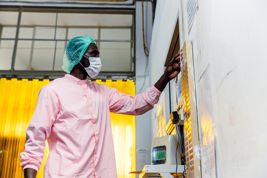 Factory worker, African Black labor Clock in to work, Check in Times shift for working in factory