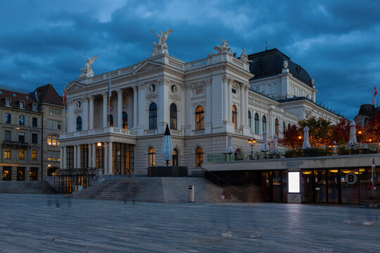 A beautiful view on the illuminated famous Zurich Opera House on an early evening with an impressive cloudscape. The theatre is located at the Sechsel&auml;uten square which is also used for many events du